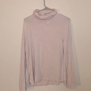 Beige turtleneck. Soft can easily dress up or for lounging.